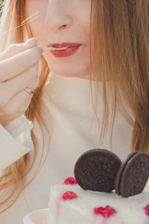 Close up of Woman Eating Cake