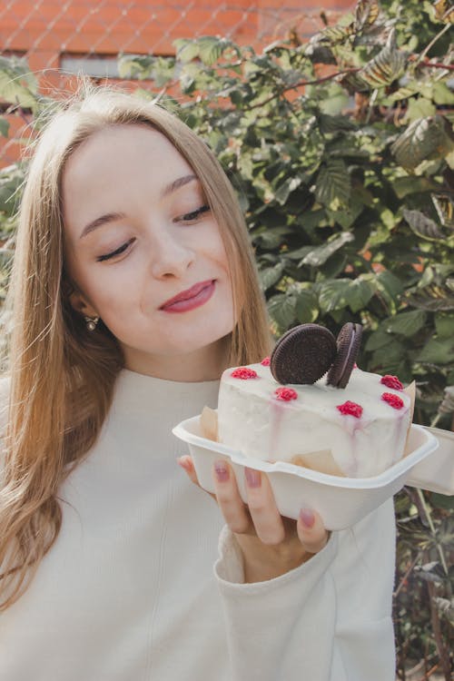 Smiling Woman Looking at Cake
