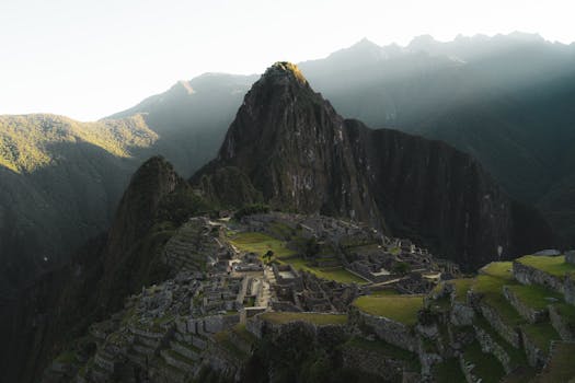 Experience the breathtaking beauty of Machu Picchu at sunrise, a UNESCO World Heritage Site in Peru.
