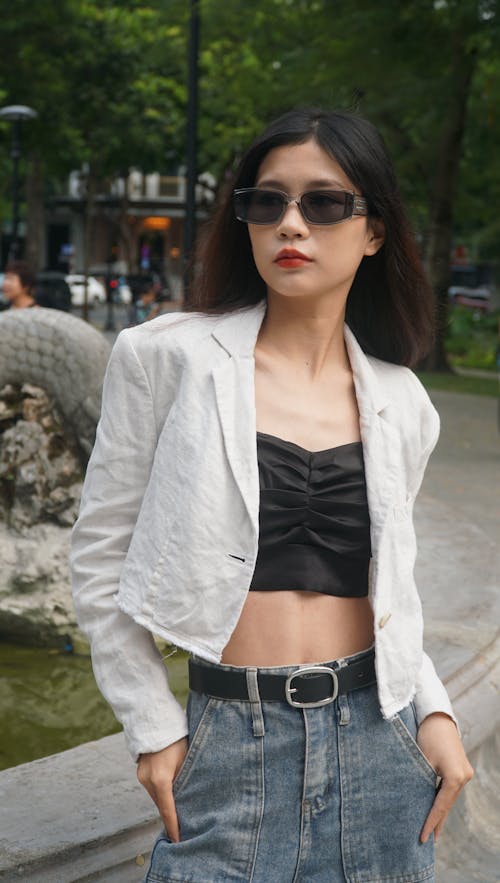 Model in Sunglasses and White Shirt in Park