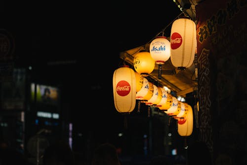 Yellow Paper Lanterns Hanging from Restaurants Roof