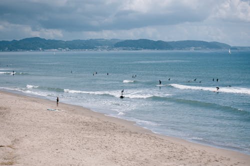 deniz, dinlenme, insanlar içeren Ücretsiz stok fotoğraf