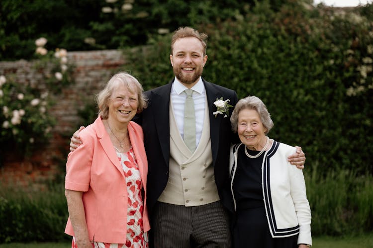 Portrait Of A Family In A Garden