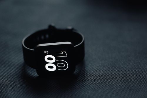 A fitness band with its display lit. Photo by indra projects on Pexels