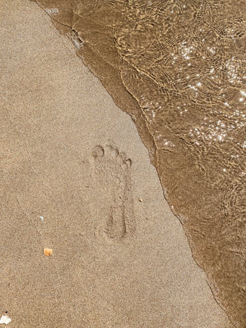 Footprint on a Sand on a Beach