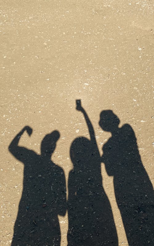 Shadow of Group of Friends on a Beach 