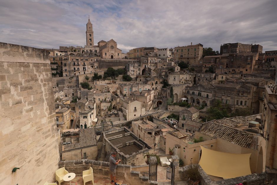 Panoramic view of the ancient town of Matera with iconic stone buildings.