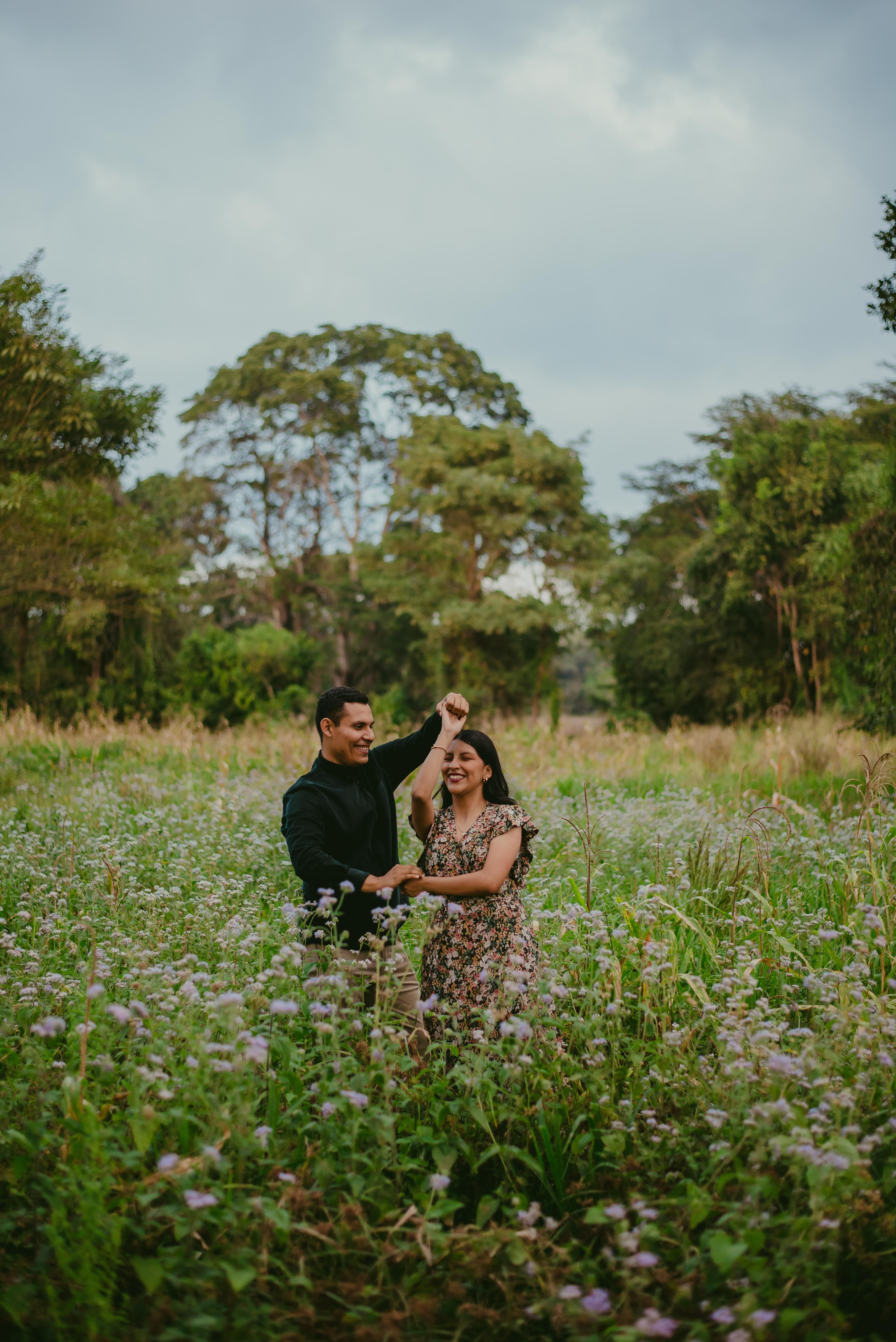 A Couple Dancing on a Grass Field · Free Stock Photo
