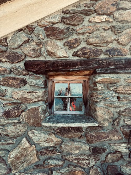 Free Small Window in an Old Stone Building  Stock Photo