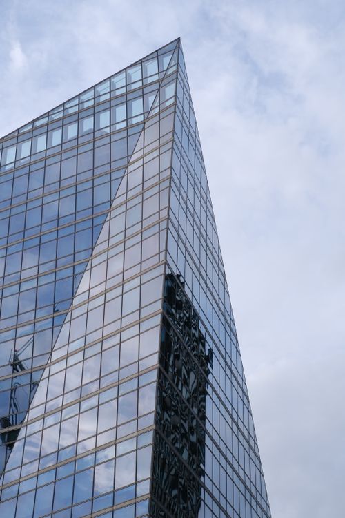 Free Glass skyscraper in London reflecting the skyline on a cloudy day. Stock Photo