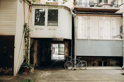 Bike in Front of an Abandoned House Buildings 