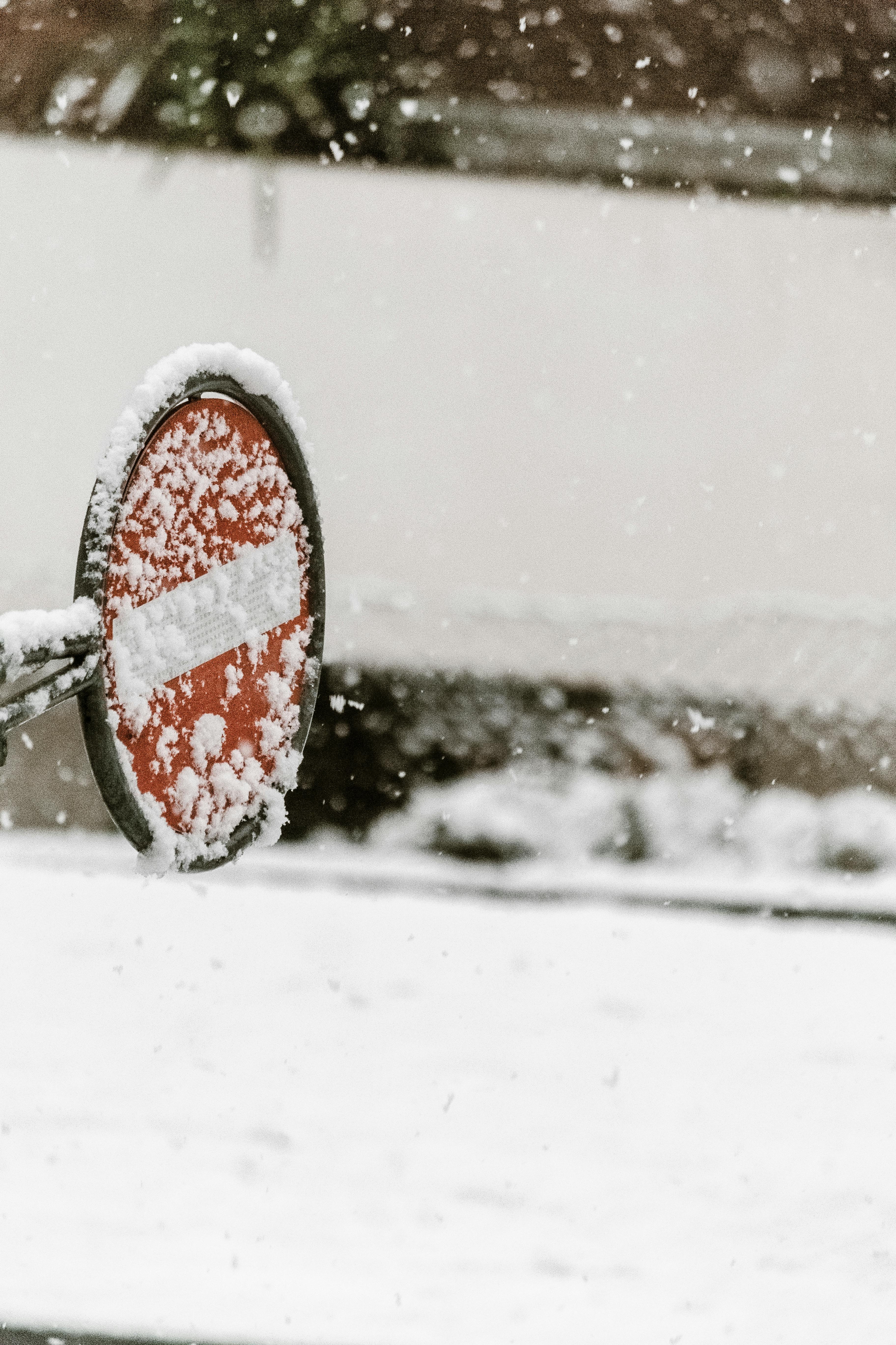 Red Stop Traffic Sign Covered in Snow