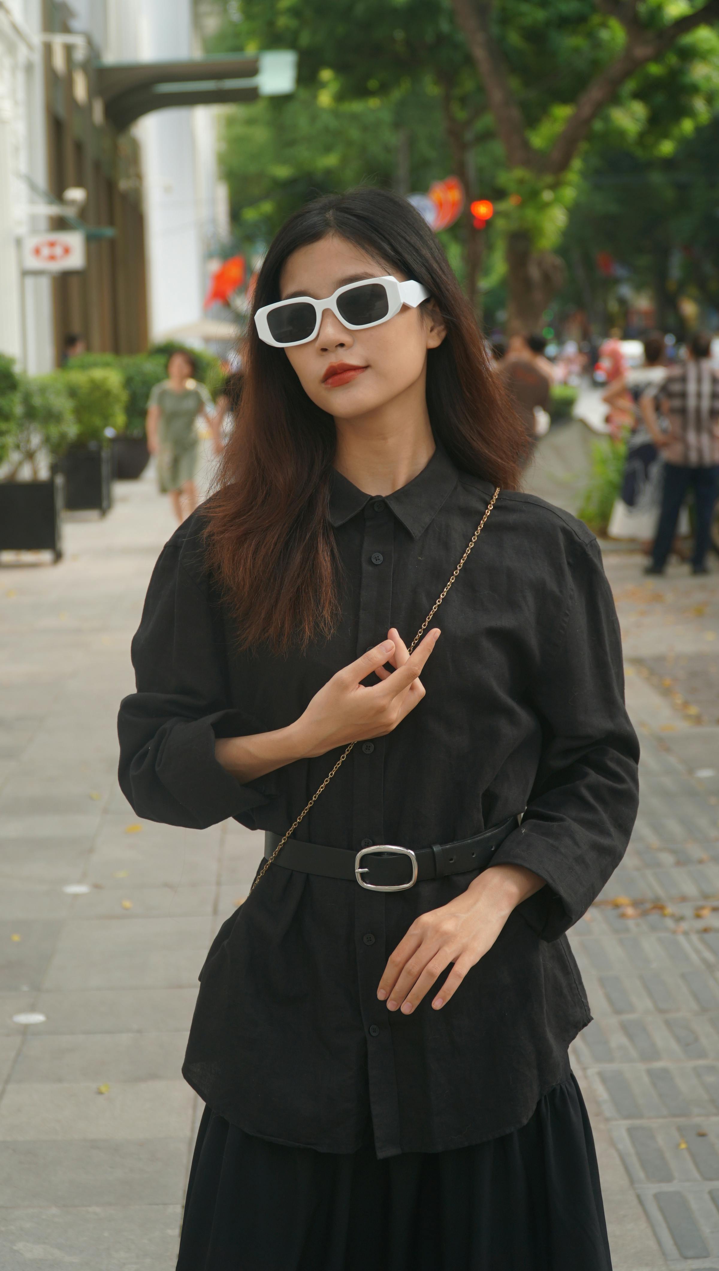 model in black shirt and clothes in town