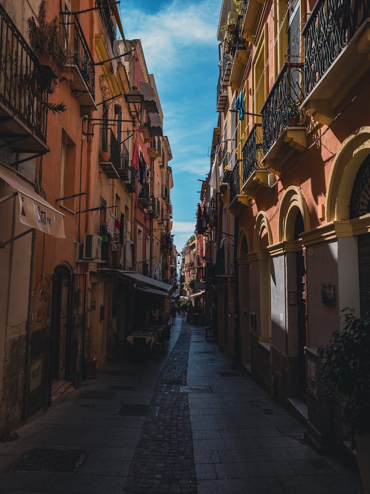 Narrow Alley In Shadow In City