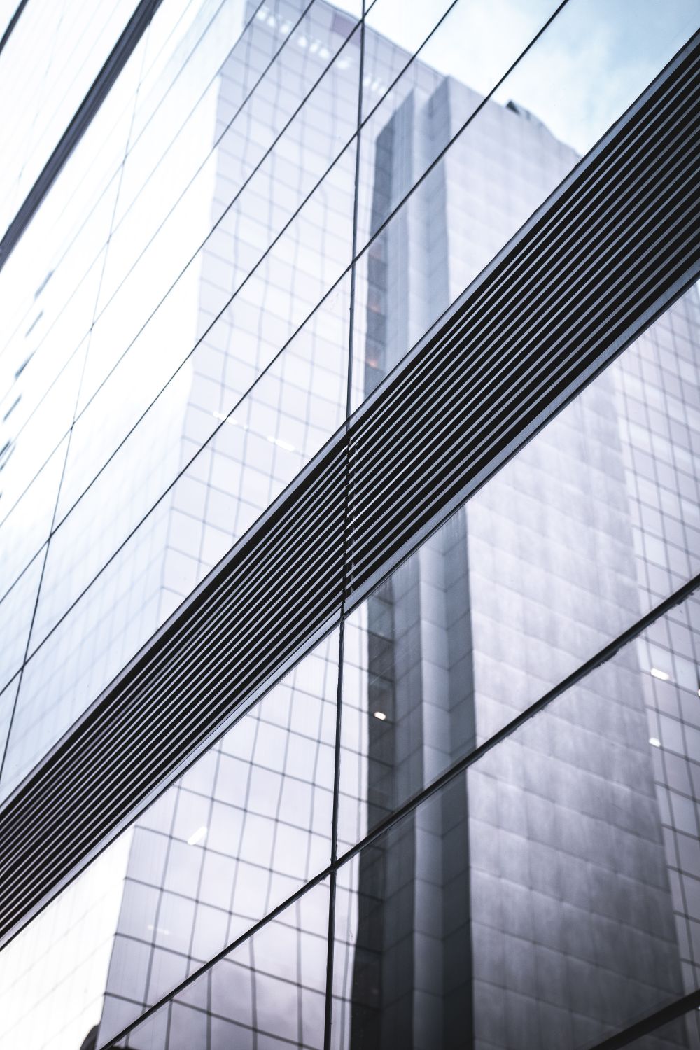 Glass High Rise Reflection of Glass High-rise Building · Free Stock Photo