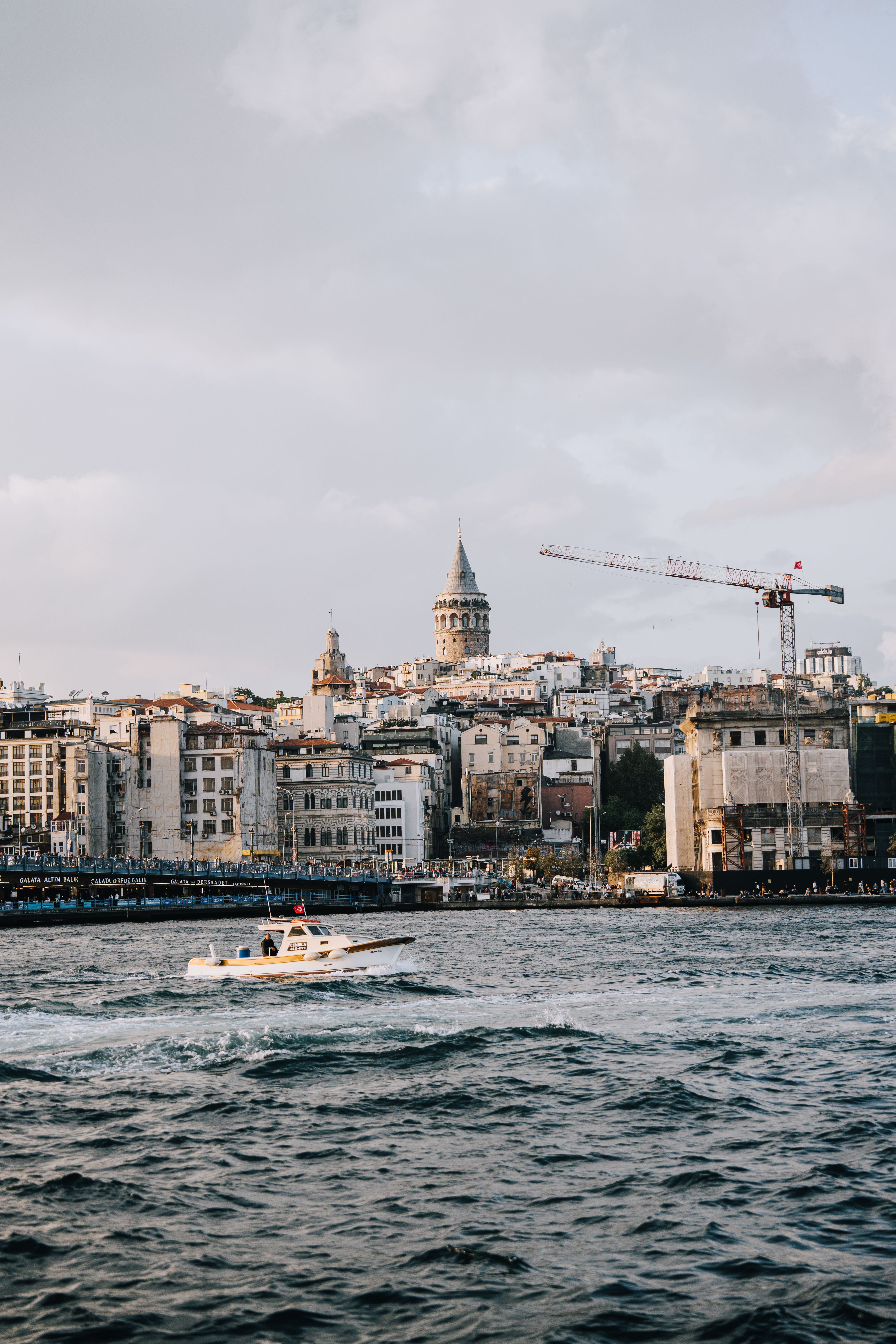 A serene scene featuring the iconic Galata Tower by the Bosporus in Istanbul, Turkey.