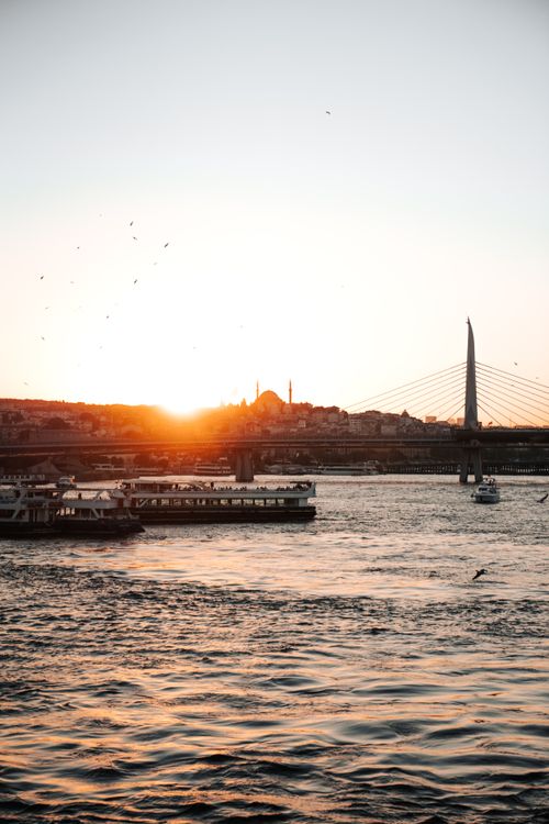 Free Stunning sunset view over Galata Bridge with Istanbul's silhouette in the background. Stock Photo