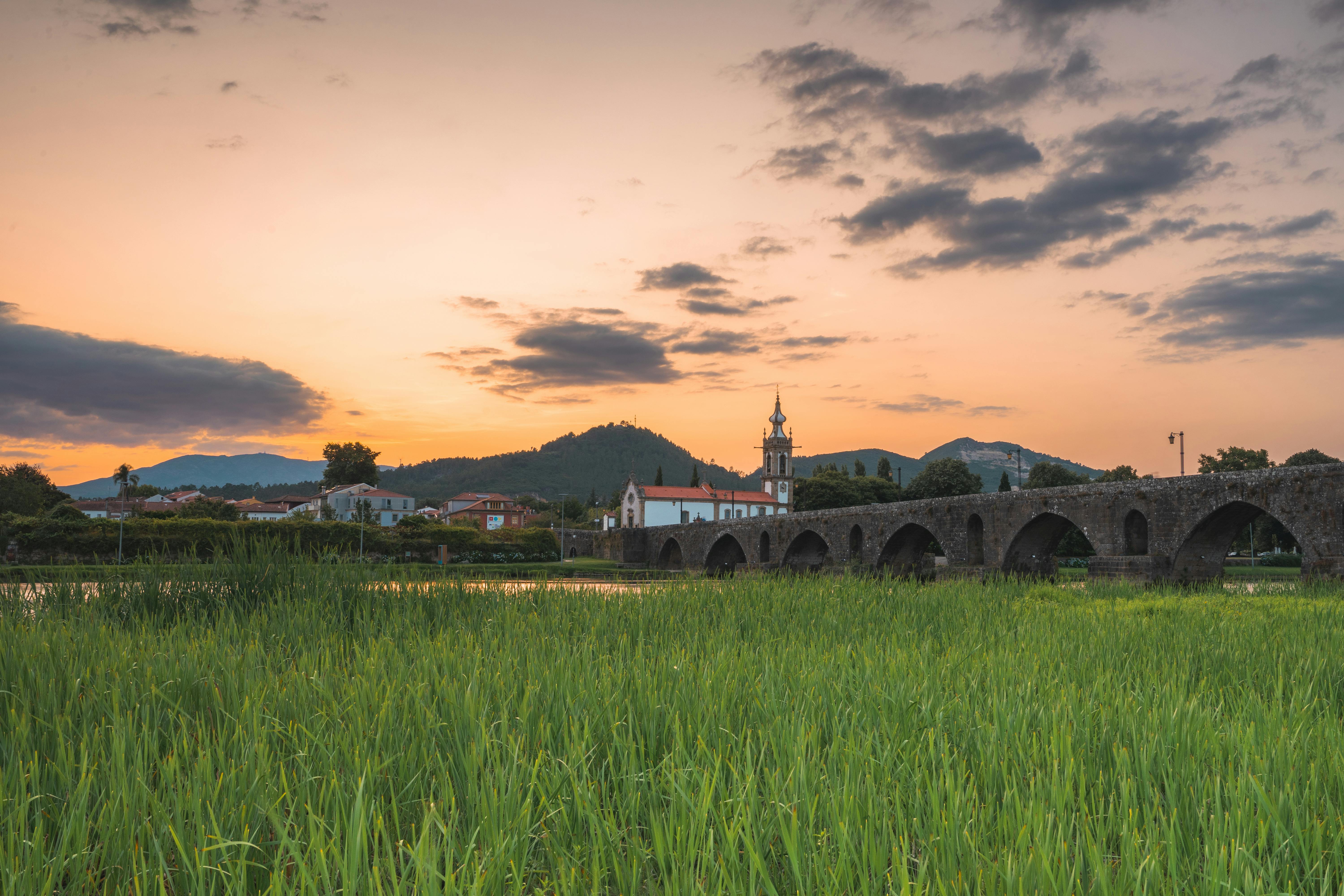 sunset at the medieval bridge at ponte de lima portugal