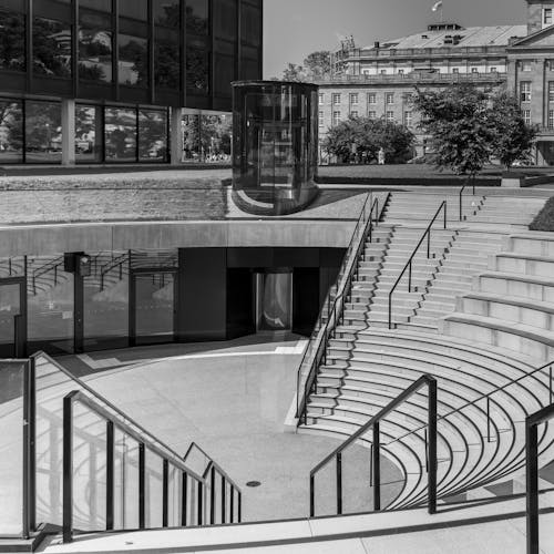 Black and White Photo of Steps on a City Square