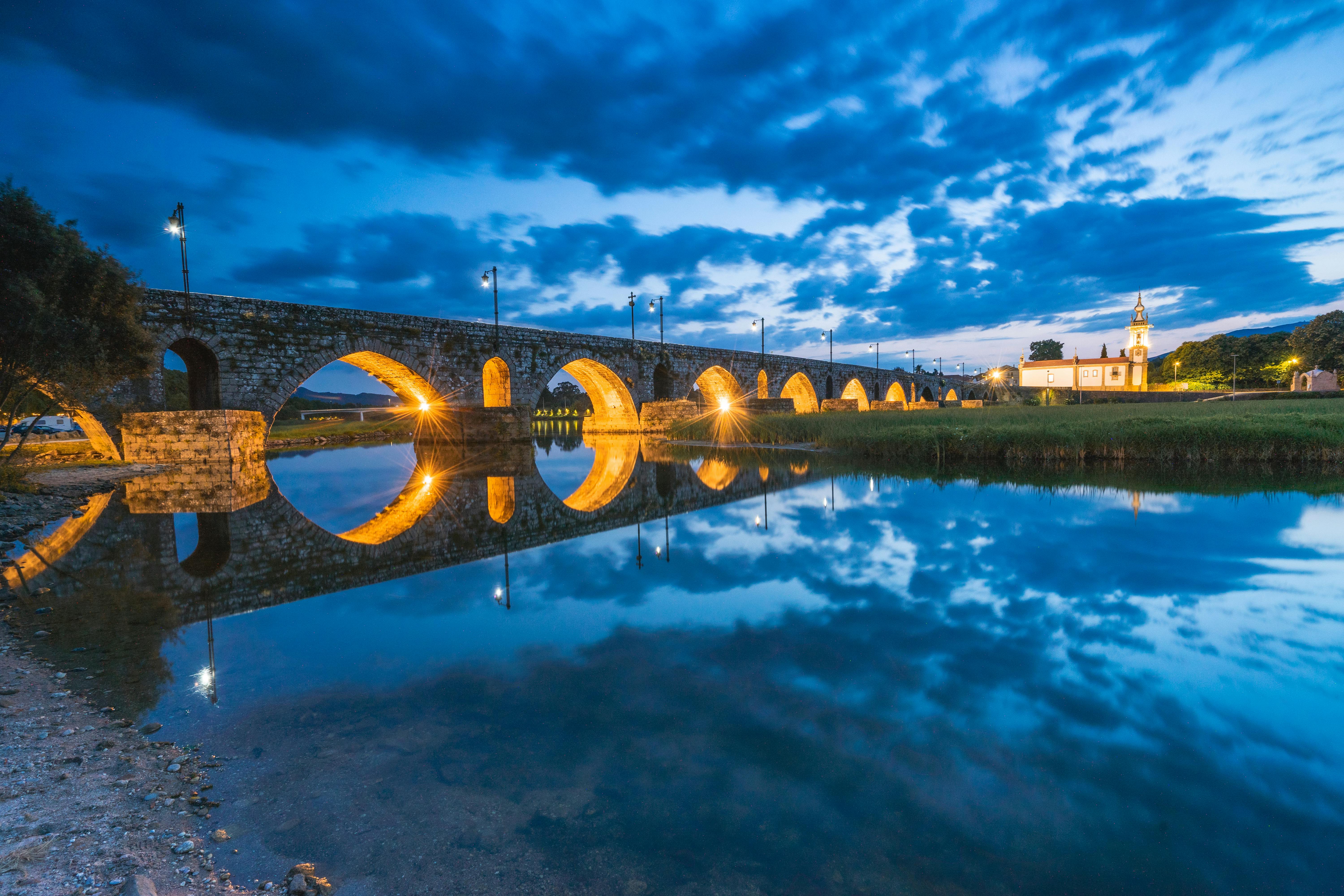 evening at the medieval bridge at ponte de lima portugal