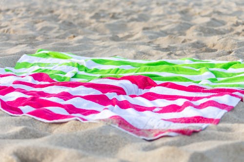 Striped Beach Towels on Sand