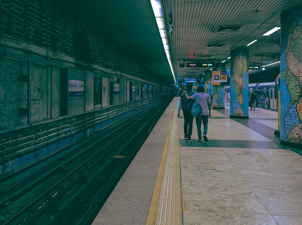 People Walking on Platform in Metro Station