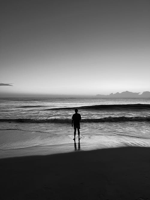 Back View of Man Looking out to Sea