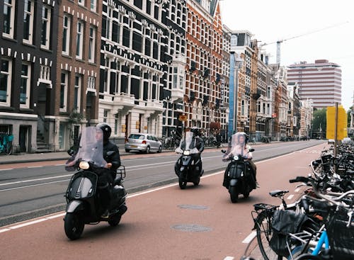 Mopeds Driving Down Busy Amsterdam Street