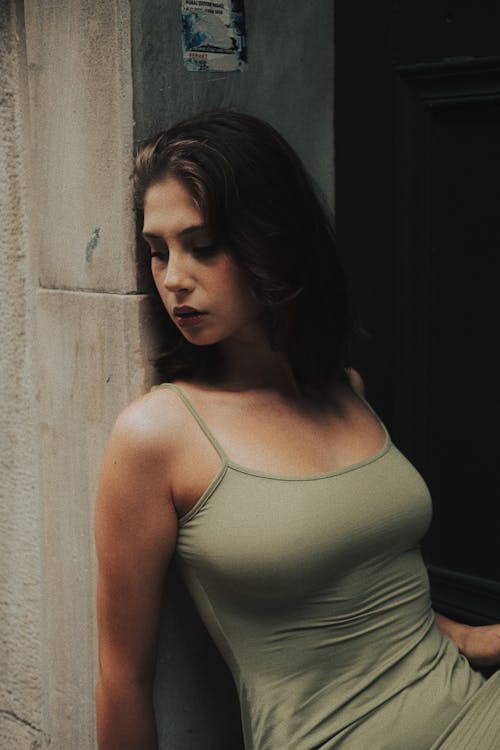 Model in Green Dress by Wall