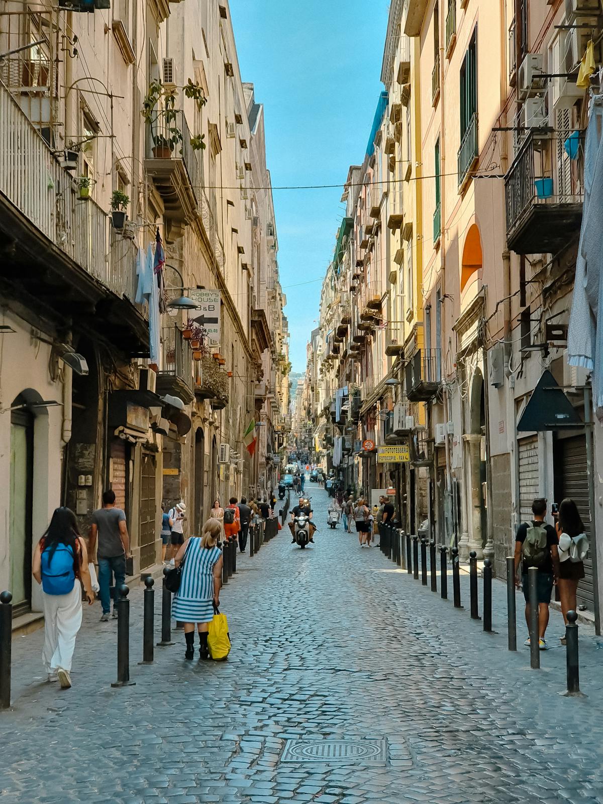 Cobblestone street in Naples, Italy evoking the historic Italian American neighborhoods