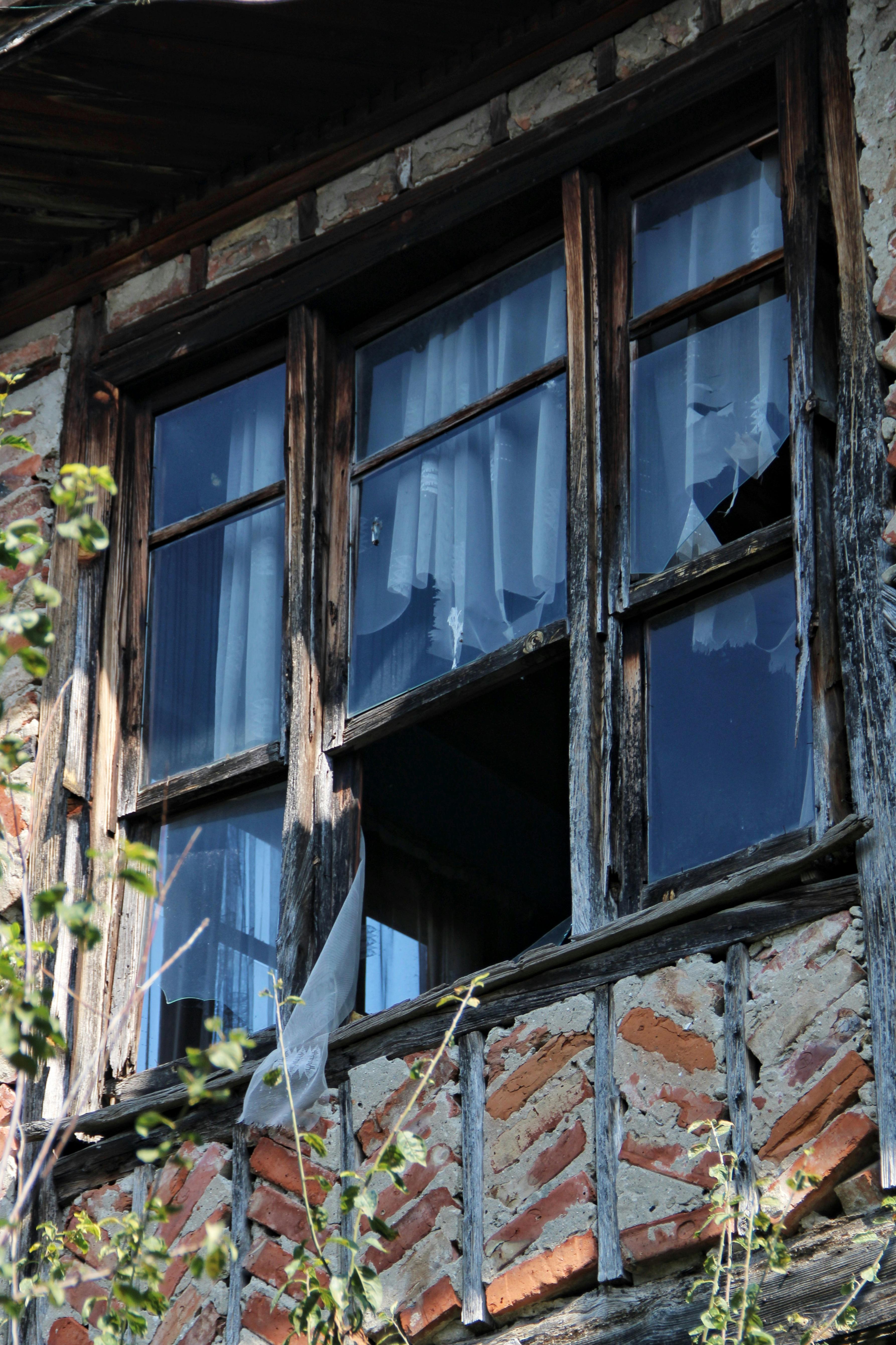 Close-up of a Broken Window in an Old Building · Free Stock Photo