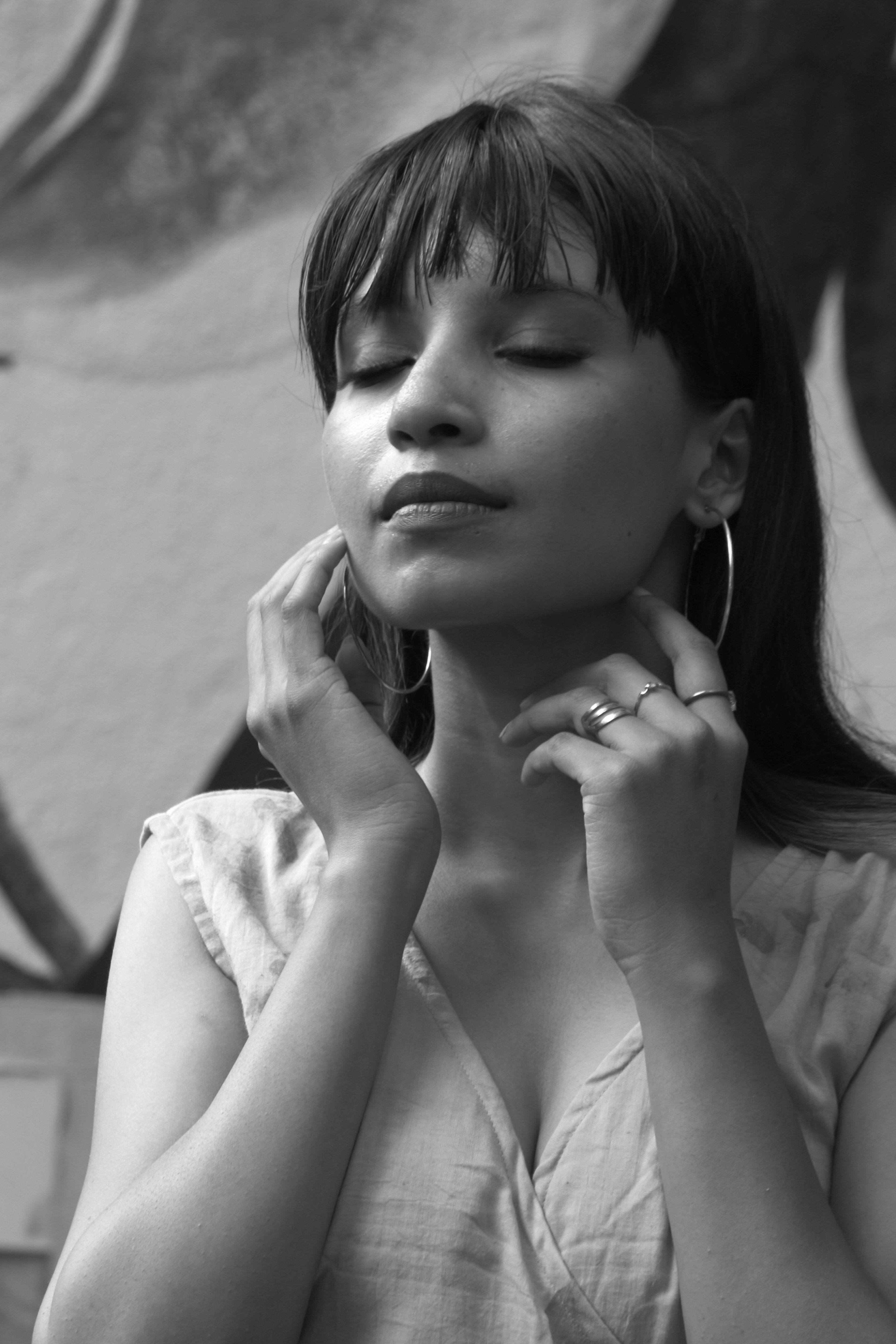 Black and White Photo of a Young Woman Standing with Eyes Closed · Free ...