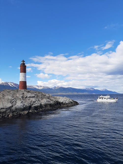 Les Eclaireurs Lighthouse and a Yacht at Sea 