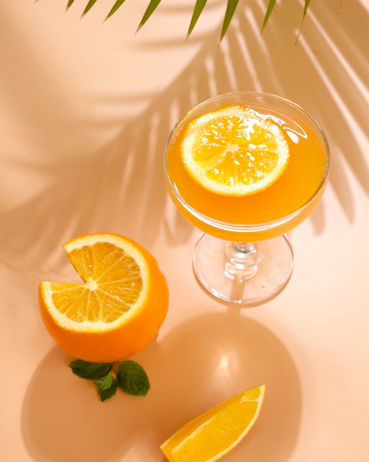 Cocktail With A Slice Of Orange Coupe Glass