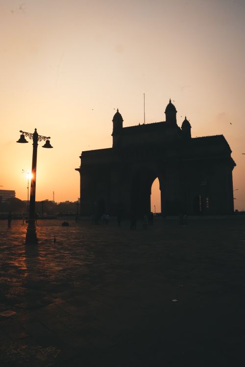 Free Dramatic silhouette of the Gateway of India during sunset in Mumbai. Stock Photo