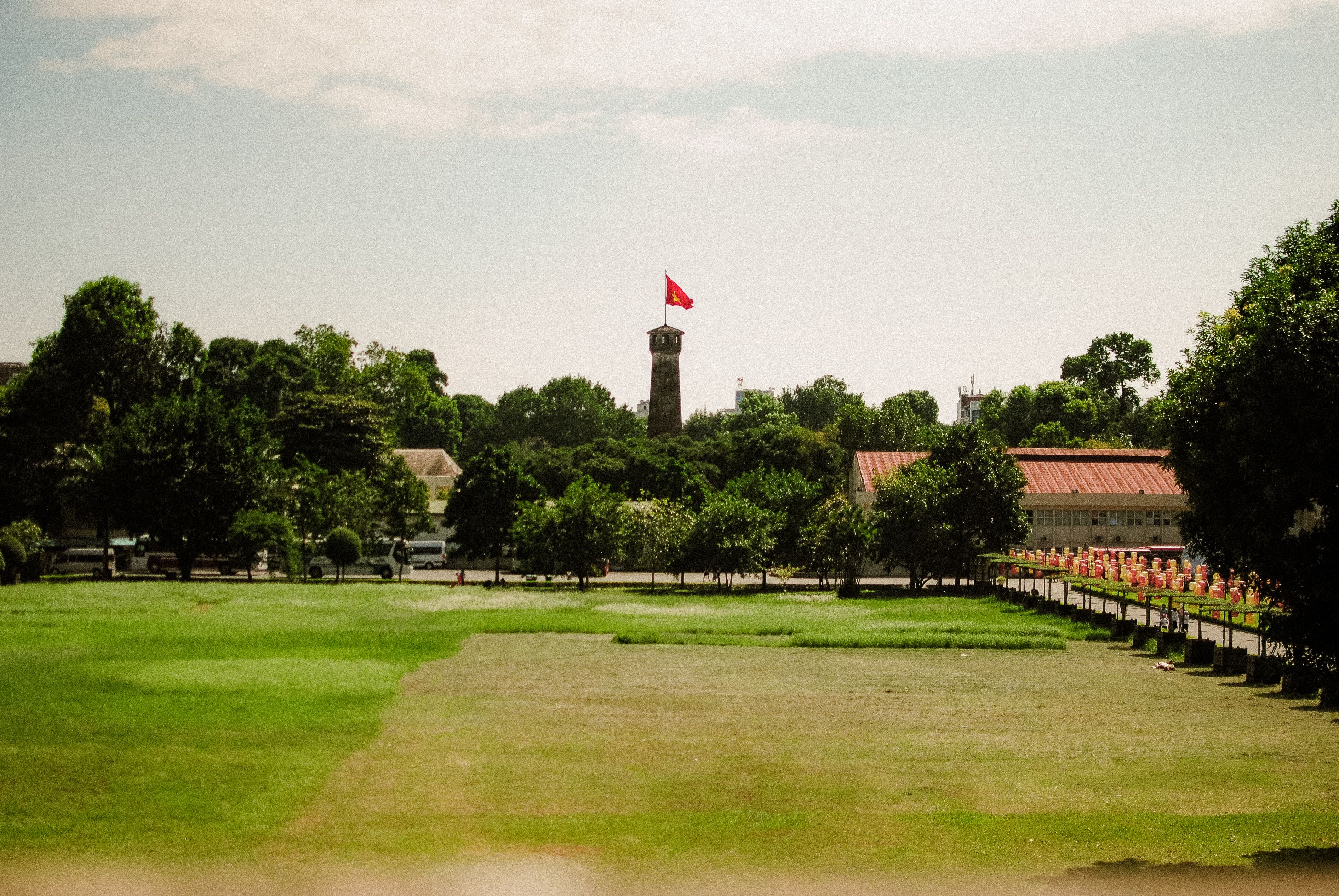 Scenic view of Flag Tower in Hanoi, Vietnam's capital, surrounded by lush greenery.