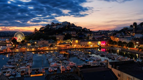 Aerial View of the Harbor and Illuminated Buildings of Torquay at Sunset, Devon, England 