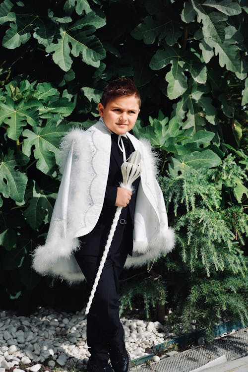 Cute Little Boy in Costume with White Gown