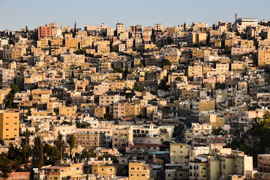 An elevated view of Amman's densely packed buildings capturing the warm urban landscape.
