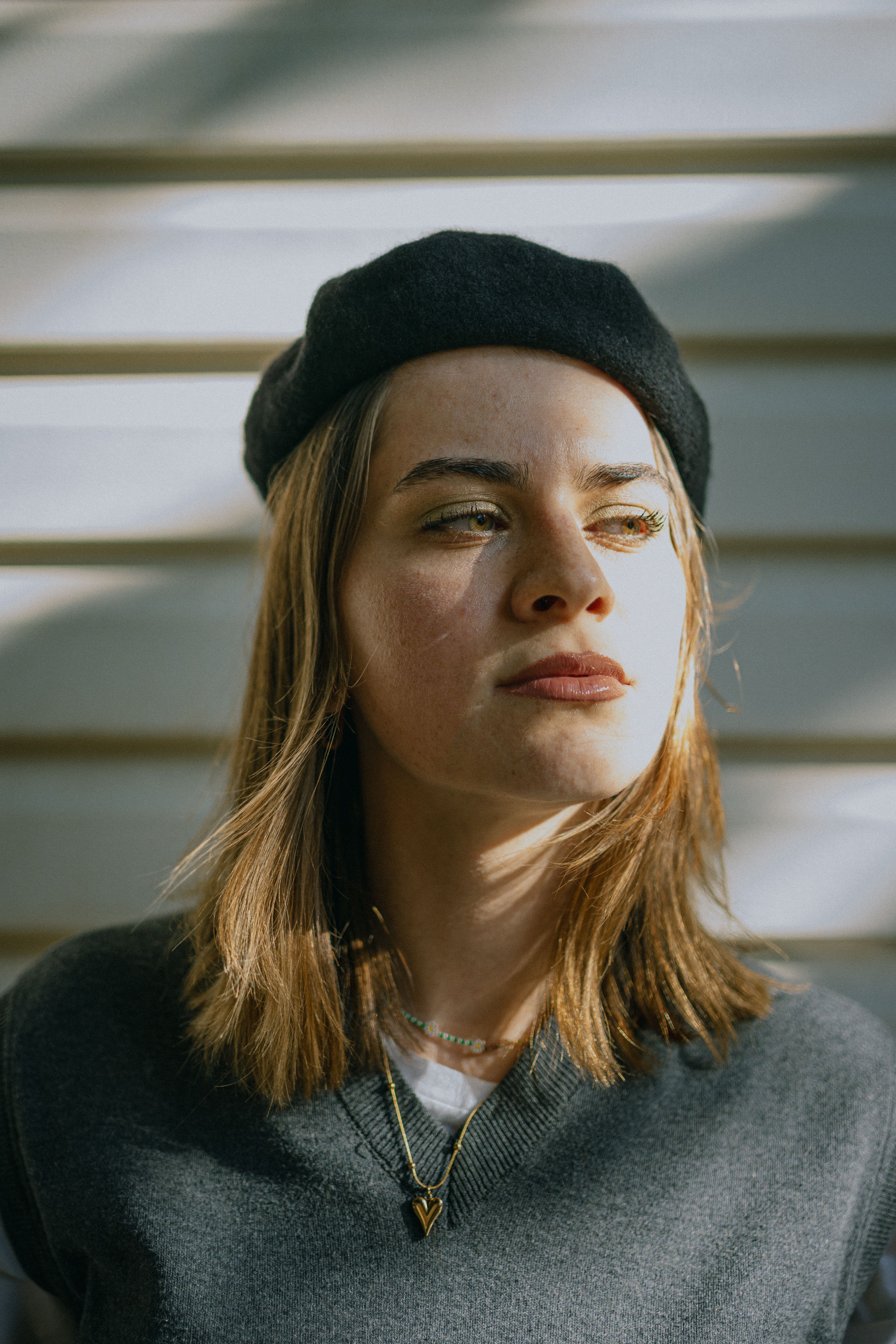 Portrait of a Pensive Young Woman in a Beret · Free Stock Photo