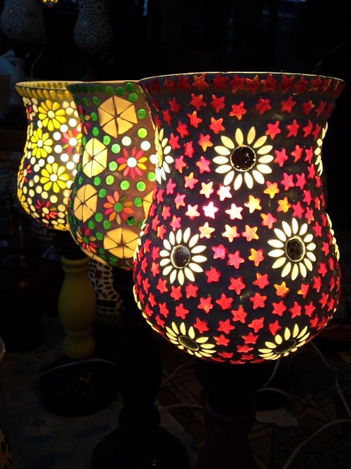 Three Multicolored Floral Table Lamps Turned on