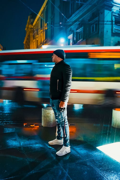 A Man in Front of a Speeding Bus