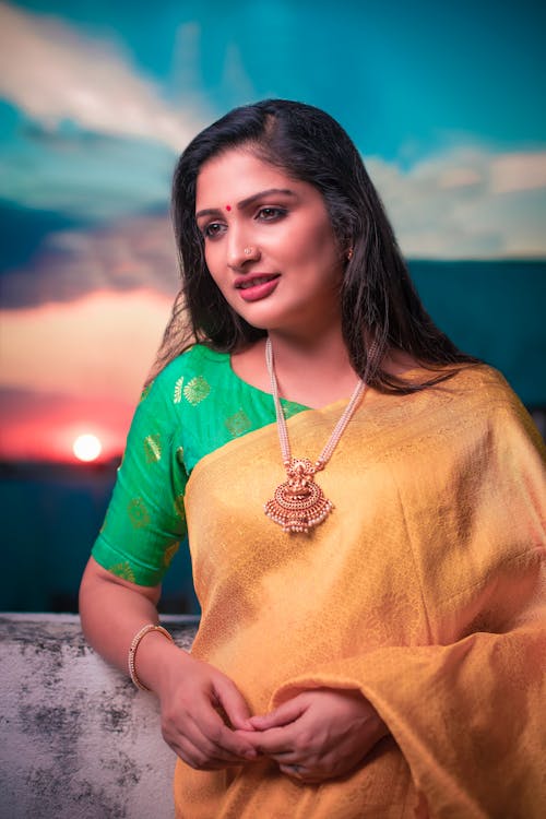 Portrait of Woman in Traditional Clothing at Sunset