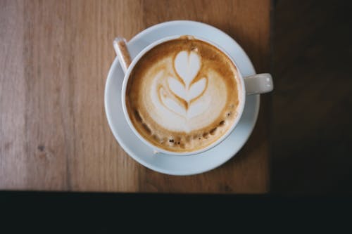 Free Cappuccino on Table Stock Photo