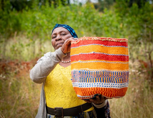 Woman Holding Colorful Basket
