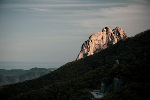 Rock Formation and Mountains at Dawn 