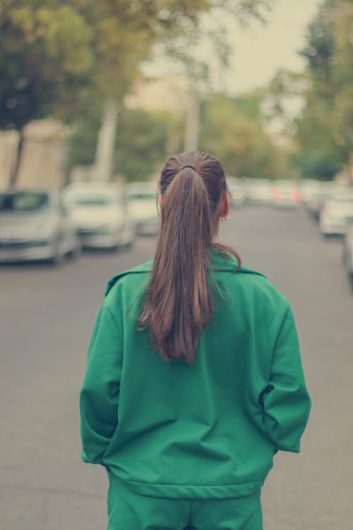 Back View of Woman in Green Clothes