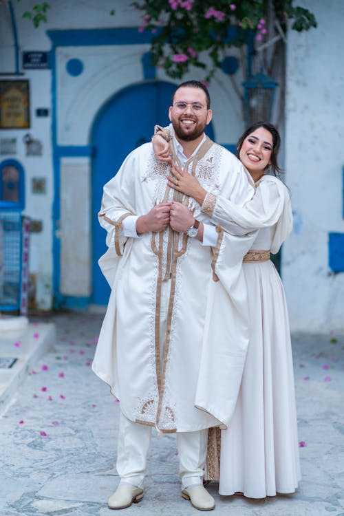 Smiling Newlyweds in Traditional Clothing