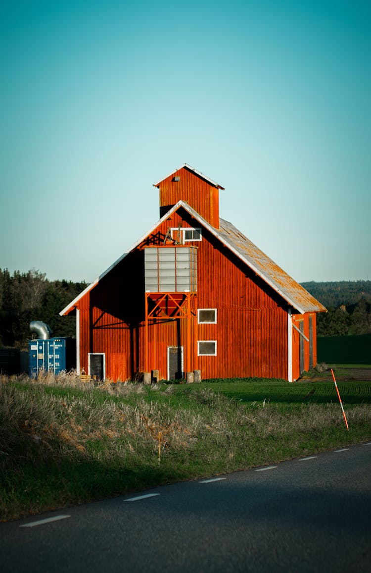 Wooden Barn Near Road In Countryside