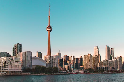 Beautiful view of Toronto's skyline featuring the iconic CN Tower during sunset.